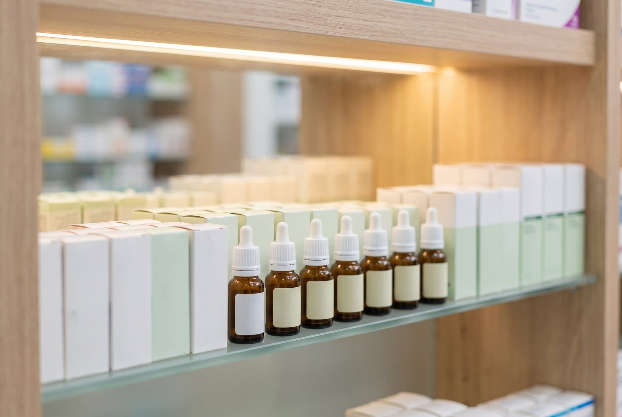 Eye medicines arranged on a pharmacy shelf