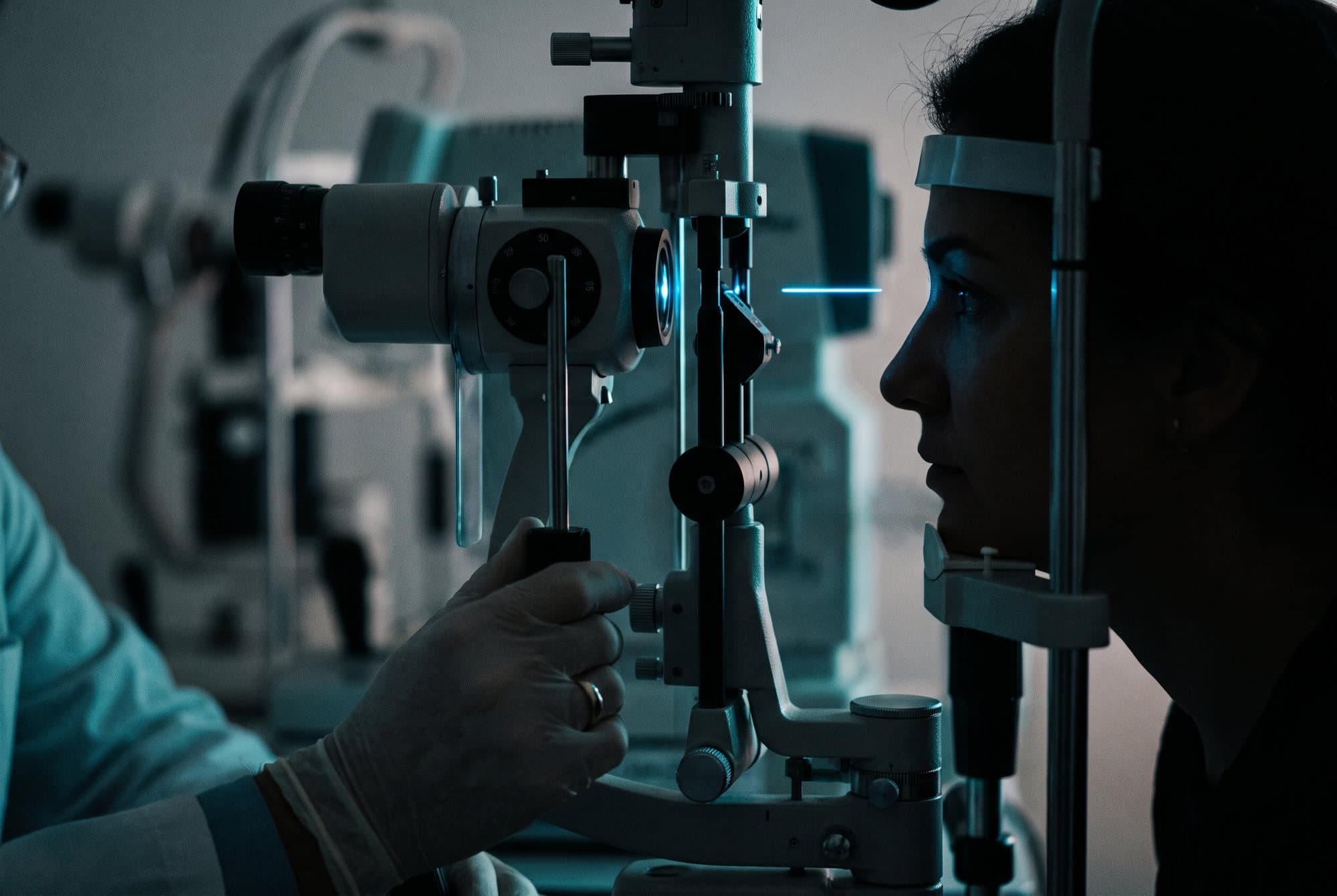 A patient undergoing a slit-lamp eye examination